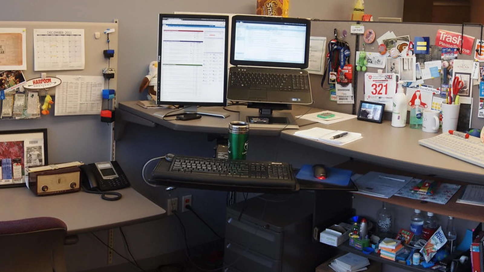 Business cards arranged in a tidy desk holder context